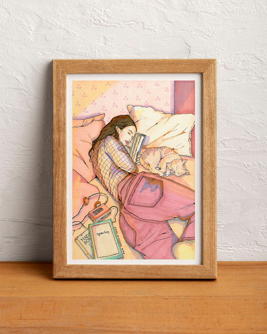 A woman sleeps peacefully in a cosy interior surrounded by objects that suggest an unhurried morning, illustrated print by Ana Jarén