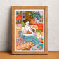 A mother breastfeeds her baby in an intimate, everyday moment of early parenthood, illustrated print by Ana Jarén