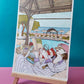 Une femme en lunettes de soleil et foulard rose lit au bord d’une piscine, entourée d’accessoires de vacances, œuvre originale d’Ana Jarén.